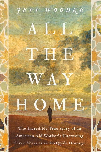 Paperback book titled "All the Way Home" by Zondervan, featuring the true story of an American aid worker's seven years as an Al-Qaida hostage.