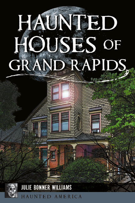 Paperback book titled Haunted Houses of Grand Rapids by History Press, featuring spooky historic house images and descriptions.
