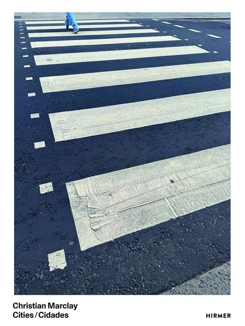 Paperback book titled "Christian Marclay: Cities" by Hirmer Verlag GmbH showing a cityscape cover with vibrant artwork.