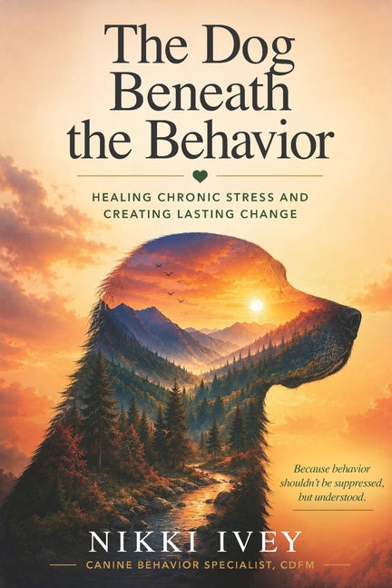 Paperback book titled "The Dog Beneath the Behavior" by Dogspeak Geek Publishing, featuring a cover image with dog-themed artwork.