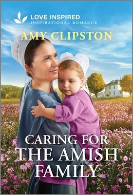 Mass market paperback of "Caring for the Amish Family" inspirational romance by Love Inspired, featuring Amish family on the cover.