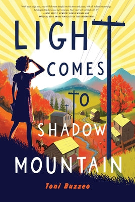 Paperback copy of "Light Comes to Shadow Mountain" by Holiday House, featuring the book cover with mountain and shadow imagery.