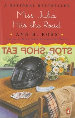 Paperback copy of Miss Julia Hits the Road by Penguin Adult HC/Tr, featuring the book cover with colorful illustrations.