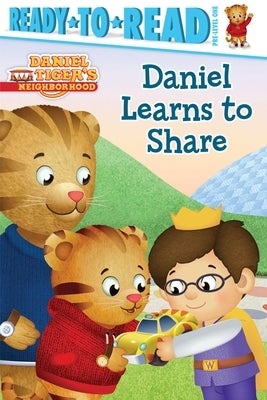 Paperback copy of "Daniel Learns to Share," a Ready-To-Read Pre-Level 1 book from Simon Spotlight featuring colorful illustrations.