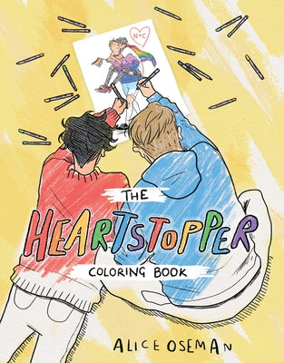 Open paperback of The Official Heartstopper Coloring Book by Graphix featuring colorful illustrated pages.