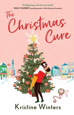 Paperback copy of The Christmas Cure by Simon & Schuster featuring holiday-themed cover art and festive design.