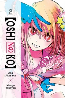 Paperback of Oshi No Ko, Volume 2 by Yen Press featuring the cover art with vibrant manga illustrations.