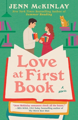 Paperback copy of "Love at First Book" by Berkley Books showing the front cover with romantic-themed artwork.