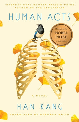 Paperback of "Human Acts" by Hogarth Press featuring the book cover with title and author text visible.