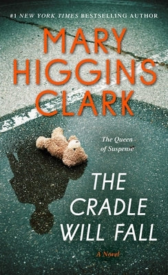 Mass market paperback of "The Cradle Will Fall" by Pocket Books, featuring a cover image with suspenseful artwork.