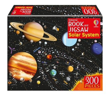 Usborne Books paperback "The Solar System" with a colorful jigsaw puzzle featuring planets and space scene.