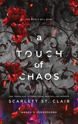 Paperback copy of "A Touch of Chaos" by Bloom Books, featuring a colorful, abstract cover design.