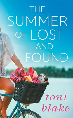Paperback of "The Summer of Lost and Found" by Montlake, showing the book cover with summer-themed artwork.