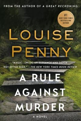 Paperback copy of "A Rule Against Murder" by Chief Inspector Gamache, published by Minotaur Books, showing the book cover.