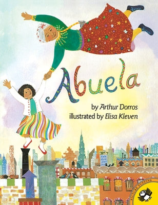 Paperback copy of "Abuela" by Puffin Books featuring colorful cover art with an illustration of a grandmother and children.