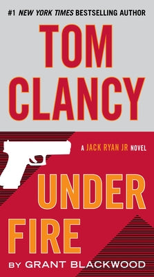 Mass market paperback of Tom Clancy Under Fire by Berkley Books, showing the book cover with bold title text