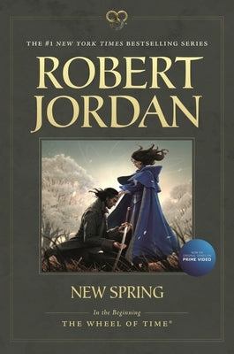 Paperback of "New Spring" by Tor Trade, featuring a cover with vibrant artwork and title text.