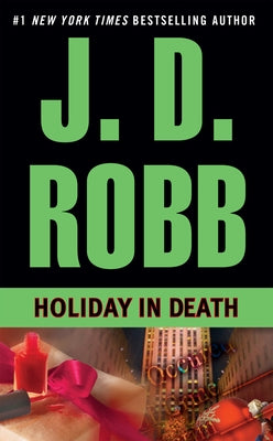 Mass market paperback of "Holiday in Death" by Berkley Books featuring a festive holiday-themed cover design.