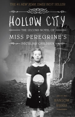 Paperback copy of "Hollow City," the second novel in Miss Peregrine's Peculiar Children series by Quirk Books, with book cover visible.