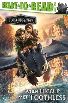 Paperback of "When Hiccup Met Toothless" Ready-To-Read Level 2 book by Simon Spotlight showing the front cover with colorful illustrations.