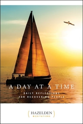 Paperback book titled "A Day at a Time: Daily Reflections for Recovering People" by Hazelden Publishing on a plain background.