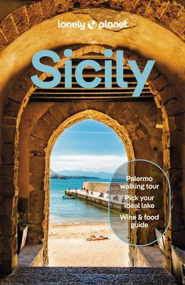 Paperback Lonely Planet Sicily travel guide with colorful cover, featuring a map and images of Sicilian landmarks.