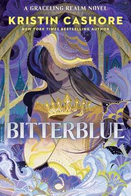 Paperback of Bitterblue novel by Penguin Books, featuring the book cover with colorful artwork and title text.