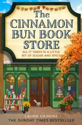 Paperback of The Cinnamon Bun Book Store by One More Chapter, showing the book cover with warm cinnamon bun imagery.