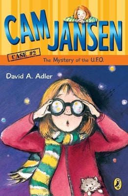 Paperback copy of "Cam Jansen: The Mystery of the U.F.O." by Puffin Books, showing the cover with a UFO illustration.