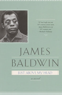 Paperback copy of "Just Above My Head" by Delta, featuring the book cover with bold title and author name.