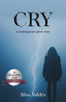 Paperback copy of the book "Cry" by Pinata Books, featuring the cover with colorful artwork and title text.