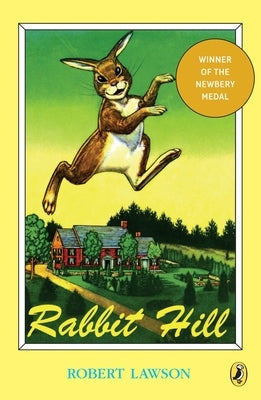 Paperback copy of "Rabbit Hill" by Puffin Books, showing the book cover with colorful illustrations.