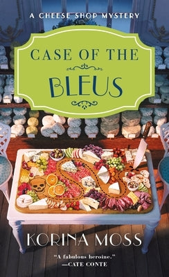 Cover of "Case of the Bleus: A Cheese Shop Mystery" mass market paperback by Minotaur Books, featuring a colorful book cover design.