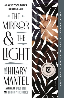 Paperback of The Mirror & the Light by Picador USA, featuring a close-up of the book cover with title and author details.