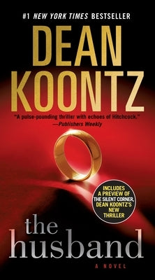 Mass market paperback of "The Husband" by Bantam, showing the book cover with title and author details.