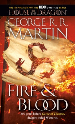 Mass market paperbound copy of Fire & Blood by Random House Worlds featuring cover art with medieval dragon and throne imagery.