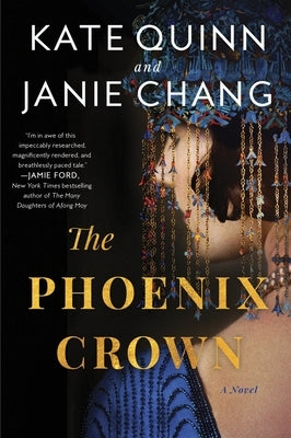 Close-up of the paperback book "The Phoenix Crown" by William Morrow & Company, showing the front cover design.