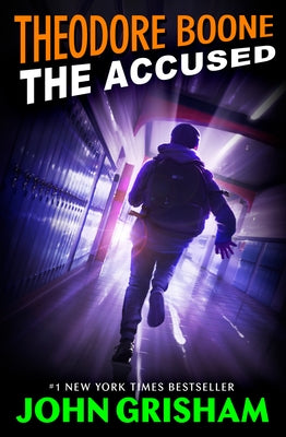 Paperback of Theodore Boone: The Accused by Puffin Books featuring a book cover with title and author’s name.