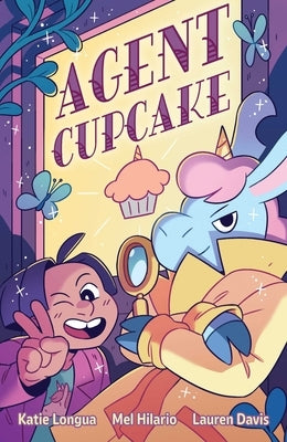 Paperback copy of Agent Cupcake comic book by Oni Press featuring colorful cover art with cartoon characters.