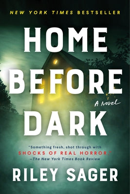 Paperback of "Home Before Dark" by Dutton, showing the book cover with dark and eerie imagery.