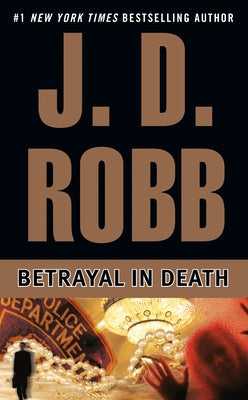 Mass market paperback of Betrayal in Death by Berkley Books, featuring a cover image with dark and mysterious artwork.
