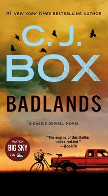 Mass market paperback of "Badlands" by Cassie Dewell, a suspense novel published by Minotaur Books, showing the book cover.