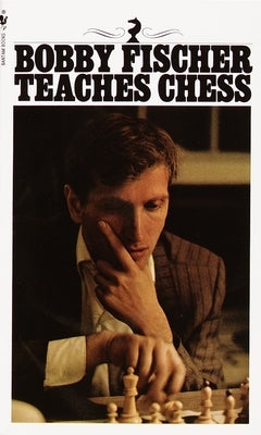 Mass market paperback of Bobby Fischer Teaches Chess by Bantam, showing the book cover with chessboard illustration.