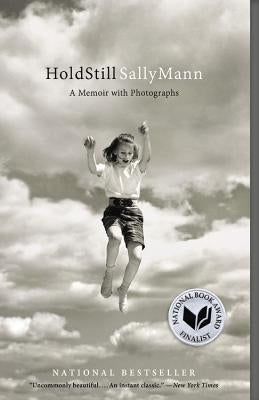 Hold Still paperback memoir with photographs by Back Bay Books, featuring a close-up of the book cover with title and author details.