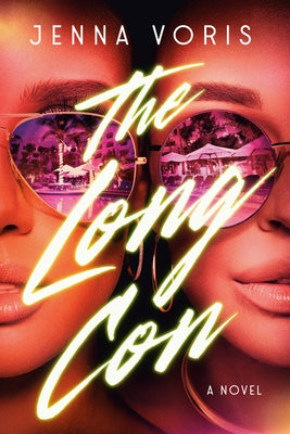 Paperback of The Long Con novel by Dial Press, featuring a close-up of the book cover with bold typography and dark design.