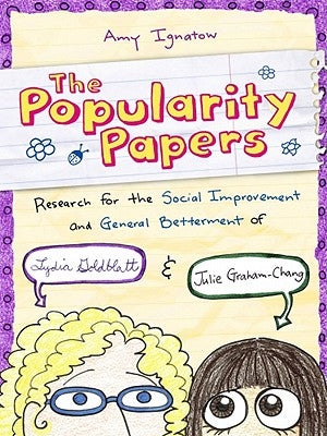 Paperback of The Popularity Papers Volume 1 by Amulet Books, featuring colorful cover art with cartoon characters Lydia and Julie.