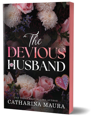 Paperback of The Devious Husband Deluxe Edition by Bloom Books, showing the book cover with dark and mysterious artwork.