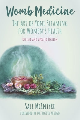 Paperback book titled "Womb Medicine" by Animal Dreaming Publishing, featuring a cover with herbal and wellness imagery for women's health.