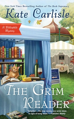 Mass market paperback of The Grim Reader by Berkley Books, featuring dark, eerie cover art with mysterious imagery.