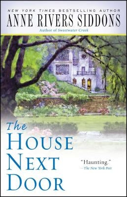 Paperback copy of "The House Next Door" by Gallery Books, showing the book cover with title and author details.
